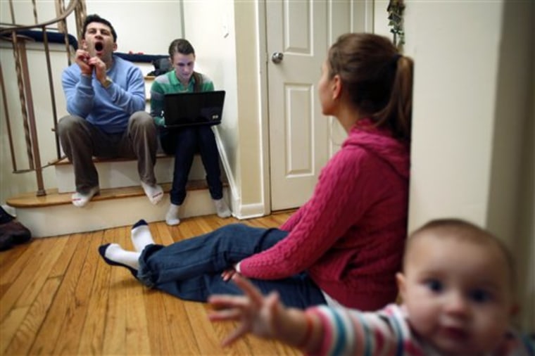 In this Jan. 19, 2010 photo, Analia Maya, second from right, and her brother Emilio Maya, left, try to recount their work for U.S. Immigration and Customs Enforcement while Emilio's wife, Kseniya Maya, second from left, types the details, at their home in Saugerties, N.Y. There was a time, when Emilio and Analia Maya's little Main Street cafe thrived and their dream of life in America seemed within reach. The brother and sister had settled in this picturesque village; he joined the volunteer fire department, she translated for the police. But they'd overstayed visitor visas and wanted desperately to fix their undocumented status. How? They made a deal with the department of Immigration and Customs Enforcement. In return for undercover tasks, they'd get work permits and eventually a special visa, they say agents promised. Years of clandestine assignments followed, a late-night stakeout at a house of prostitution and similar risky work. Then something changed. Emilio was seized by agents, including his